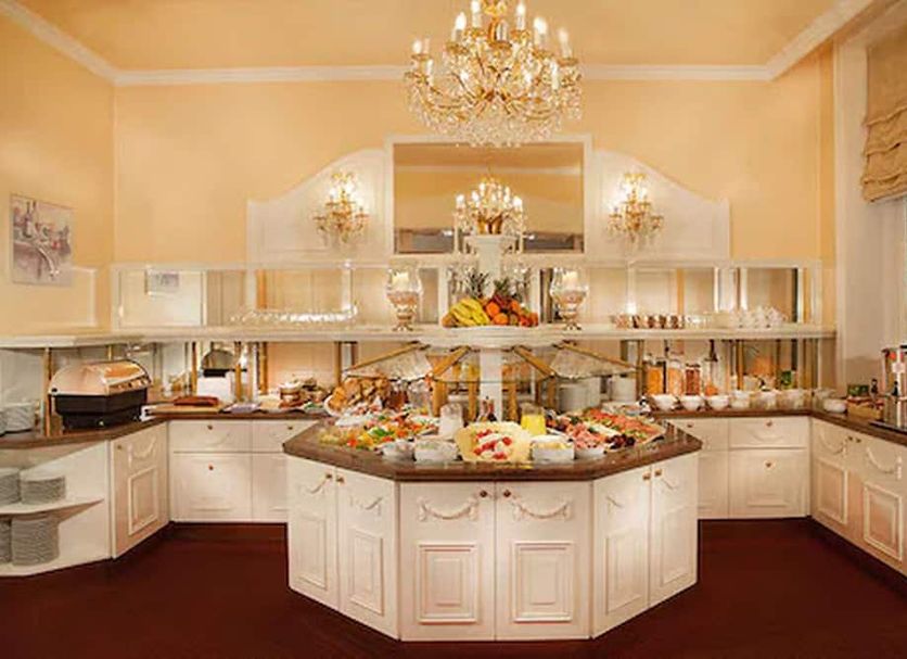 Hotel Kaiserhof in Lübeck breakfast buffet in elegant dining room with chandeliers