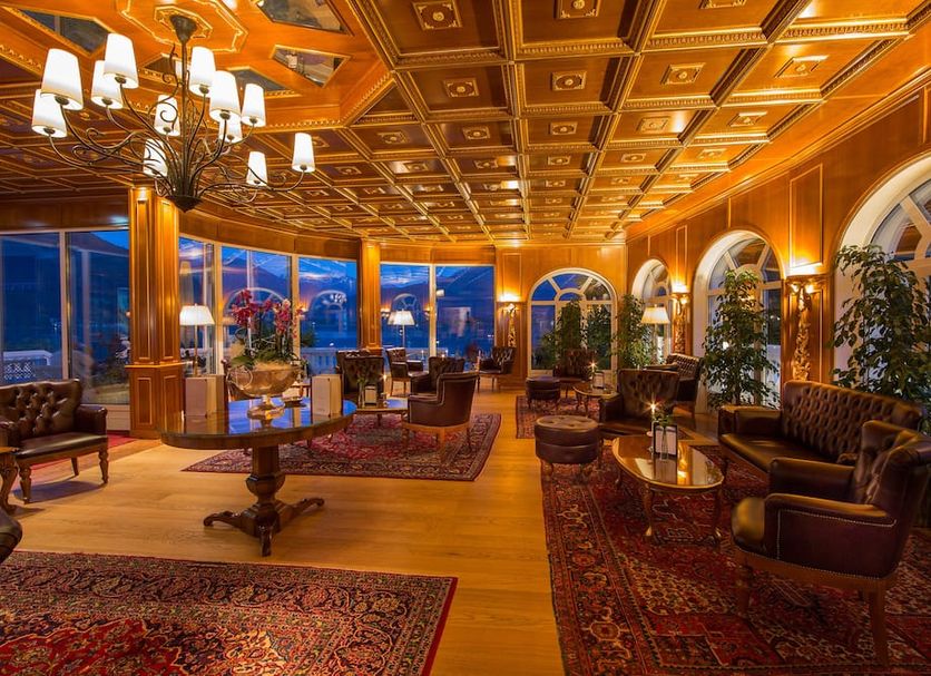 Grand Hotel Zell am See in Zell am See lounge with chandeliers, arched windows and lake views