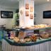 Hotel Mistral in Campo nell'Elba breakfast buffet with pastries, fruit and seating area
