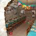 Albergue Rural Cal Picarol dining room in Àger with long set tables, chairs, and festive bunting