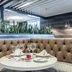 The Burgundy Hotel, Little Rock: upscale restaurant booth with set table and modern lighting