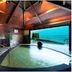 Hakone Ginyu in Hakone: indoor hot spring bath with ocean view through open side
