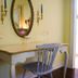 Gatekeeper's Retreat in Niagara-on-the-Lake: quaint vanity table with oval mirror, chair, and blue bowl
