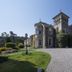 Loch Ness Country House Hotel in Inverness, stone country house with gravel driveway and landscaped gardens