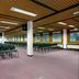 Yarnfield Park Training And Conference Centre in Stone, large conference room with rows of green chairs
