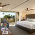 Mana Kai Maui in Kīhei guest room with king bed, sitting area and ocean-view balcony