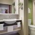 Disney's All-Star Movies Resort bathroom with pedestal sink, toilet, and shower-tub combo in Bay Lake
