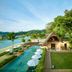 Gaya Island Resort in Kota Kinabalu with beachfront infinity pool, palm trees, and lush hillside views