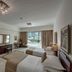 Marina Hotel Apartments in Dubai bedroom with two beds, balcony view, seating area and TV