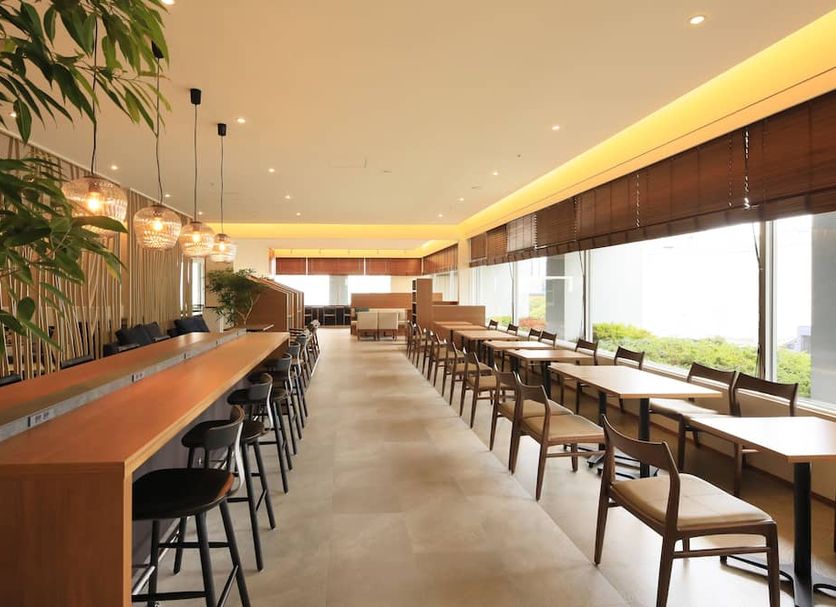 Richmond Hotel Premier Sendai Ekimae dining area with long communal tables and large windows in Sendai