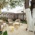 Transamerica Wise Indaiatuba outdoor seating area with wicker chairs, small tables, and trees