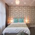 W12 Rooms London guest room with double bed, floral wallpaper, bedside lamps and full-length mirror
