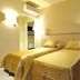 Residence Diamanterosso in Terni twin room with two single beds, wall lights, and air conditioning