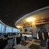 Lera Hotel Guangzhou dining room with curved ceiling, large windows, and city views