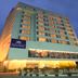 Royal Orchid Central Jaipur, Bani Park hotel exterior at dusk in Jaipur with illuminated facade