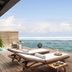Anantara Veli Maldives Resort in Veligandu Huraa with oceanfront deck and loungers overlooking the sea