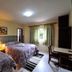 Pousada Villa Romana in Campos do Jordão, twin bedroom with striped curtains and desk