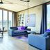 Downtown Apartments Mitte Berlin living room with floor-to-ceiling windows and city views