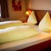 Stadthotel Augsburg guest room with twin beds and bedside lamps in Augsburg