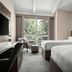 Lincolnshire Marriott Resort guest room with two beds, seating area, and large window view in Lincolnshire