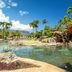 Hanalei Bay Resort in Princeville with tropical lagoon pool, palm trees, and mountain views