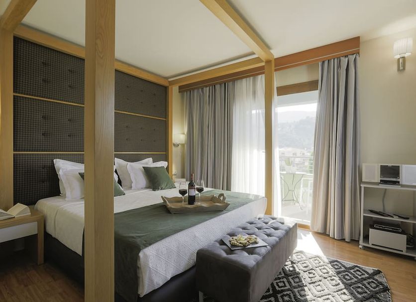 La Piscine Art Hotel, Skiathos: stylish four-poster room with balcony and mountain views