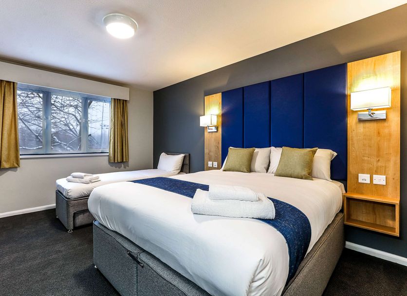 Days Inn by Wyndham London Stansted Airport room in Bishop's Stortford with king bed and window