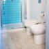 B&B I 10 Mondi Milan bathroom with glass shower, blue tile wall and bidet