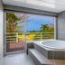 Nagahama Beach Resort Kanon in Nakijin with a bathroom bathtub and balcony ocean view