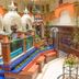 Hotel Báez Carrizal in Villahermosa courtyard with hanging vines, benches, and decorative arches