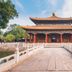 Mingcheng Hotel Beijing in Beijing with a Chinese pavilion and stone bridge over water