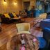 OYO The Leven Felixstowe lobby lounge with sofas, chairs, tables and patterned wallpaper