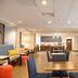 Hampton Inn Crystal River lobby with seating area and breakfast counter