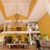 Ho Tram Beach Boutique Resort & Spa in Ba Ria lobby with soaring ceiling, staircase, and tropical plants
