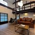 Rinn Shiki Juraku Kyoto guest room with loft sleeping area, leather sofa and coffee table