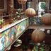 Hotel Regis Uruapan atrium with hanging woven lamps and colorful mural walls