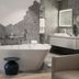 Petit Hôtel Confidentiel in Chambéry bathroom with freestanding tub, hexagon tile wall and vanity