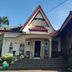 Seulawah Resort And Cafe in Batu with A-frame roofs, front steps, and a glass-walled cafe section