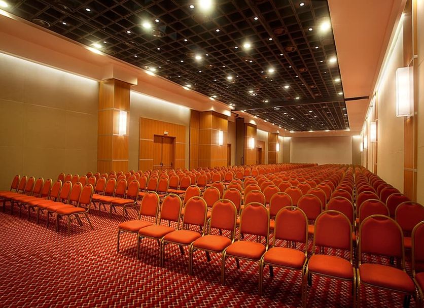Rio Othon Palace in Rio de Janeiro conference room with rows of orange chairs and ceiling lights