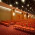 Rio Othon Palace in Rio de Janeiro conference room with rows of orange chairs and ceiling lights