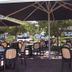 Dongara Hotel Motel in Dongara outdoor patio dining area with tables, chairs, and large umbrellas
