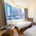 Atour Hotel Dalian Zhongshan Plaza guest room with two beds and city view in Dalian