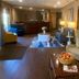 Comfort Inn Rutland - Killington lobby seating area with front desk and lounge chairs in Rutland
