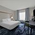 Fairfield by Marriott Inn & Suites Milwaukee Brookfield guest room with king bed, desk and window view in Brookfield