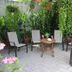 Hotel Arenas del Pacifico garden patio seating in La Crucecita with lush tropical plants