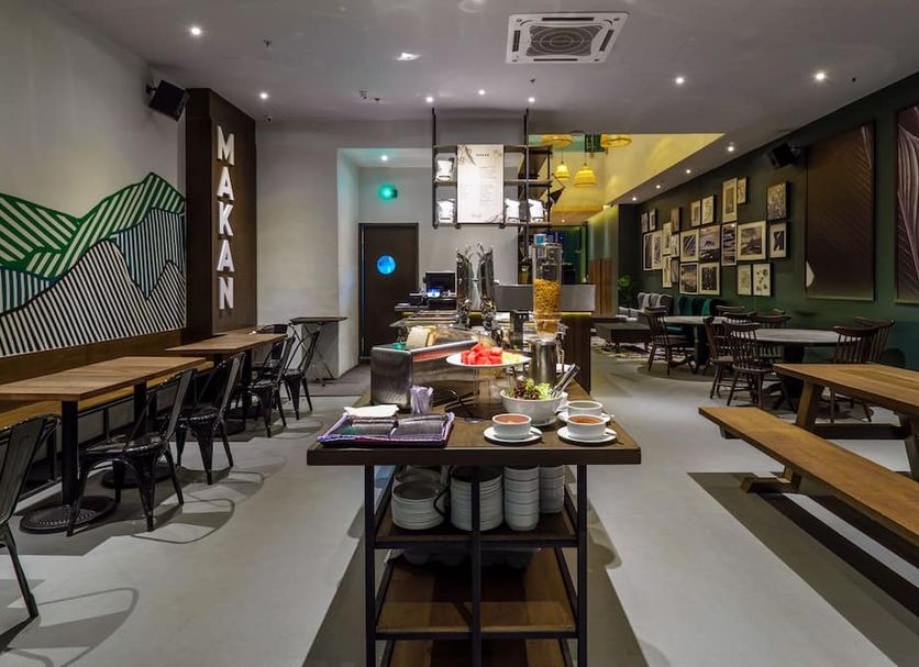 Tune Hotel - 1Borneo Kota Kinabalu dining area with long communal tables and buffet setup