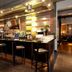 Premier Inn Birmingham City - Waterloo St bar area with high stools and illuminated shelves in Birmingham