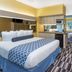 Microtel Inn & Suites by Wyndham Stockbridge/Atlanta I-75 room with bed, desk, TV and window