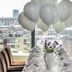 Ibis Styles Riga dining table set with balloons and city view through large windows