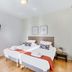 Appart'City Classic Thonon Les Bains guest room with twin beds and wall-mounted TV in Thonon-les-Bains